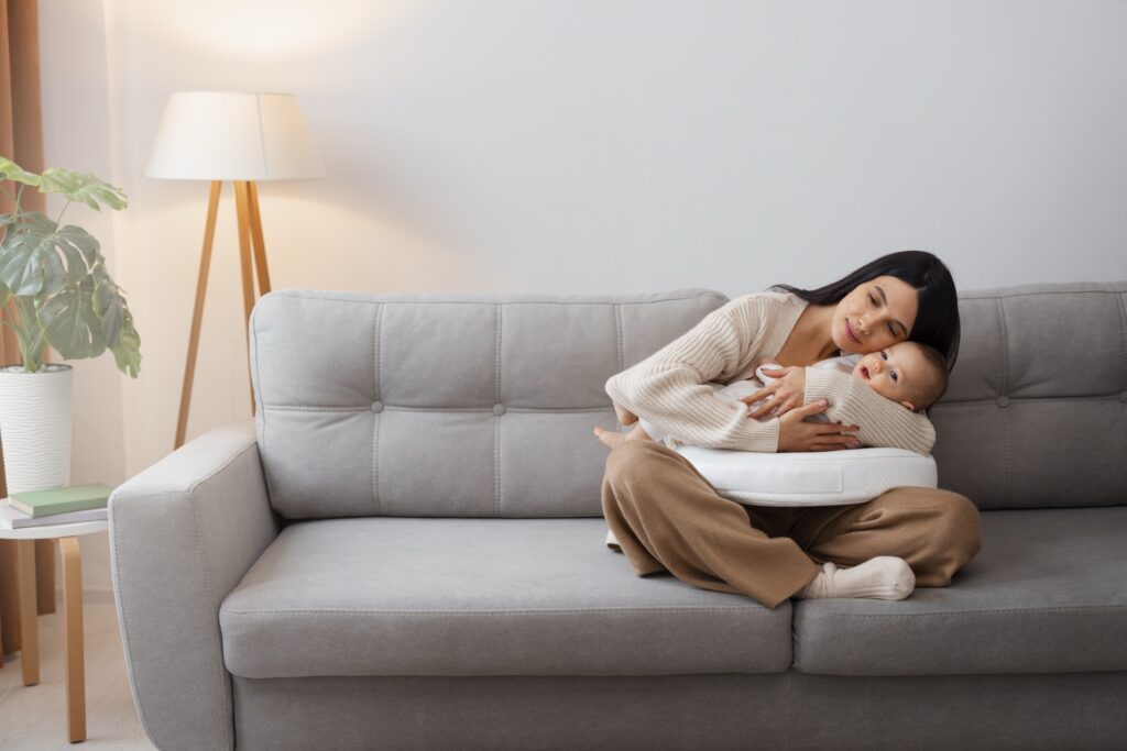 New mom and her new born ..cuddling together.